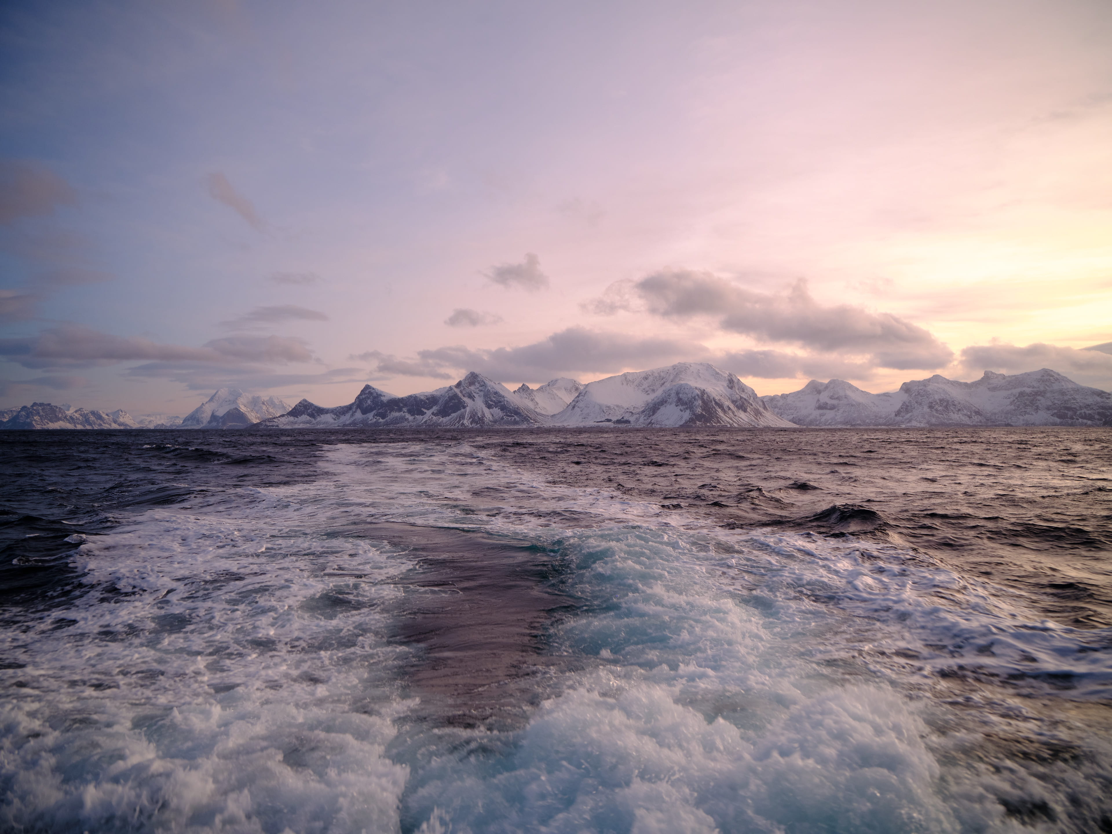 View over the sea with mountains in the horizon